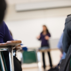 person talking in front a classroom