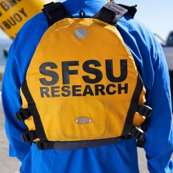 SF State affiliate wearing a SFSU Research life vest